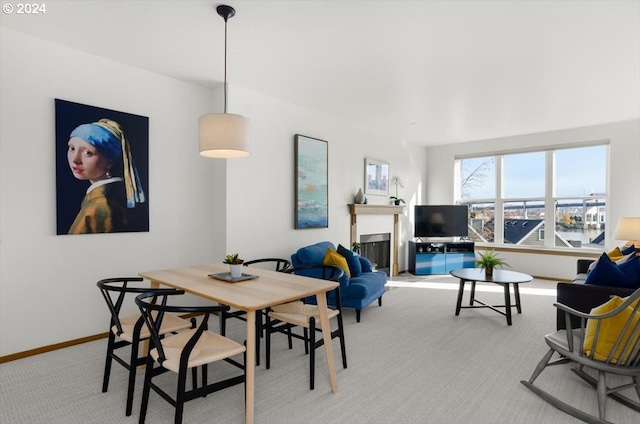 dining area with light colored carpet