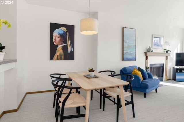 dining room featuring light colored carpet