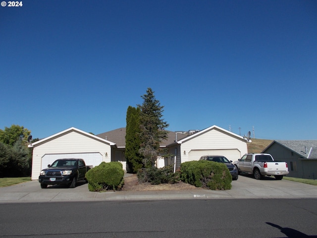 single story home featuring a garage