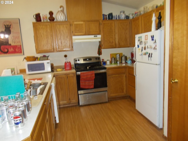 kitchen with light hardwood / wood-style floors and white appliances