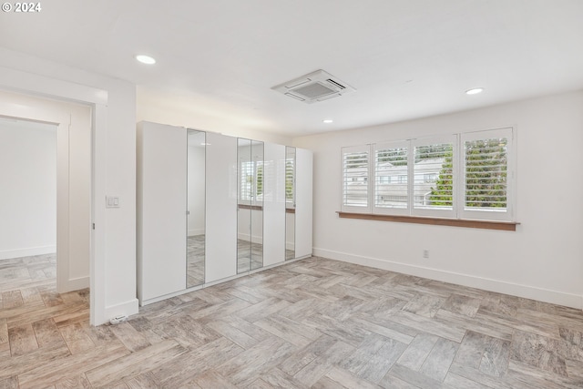 kitchen with a breakfast bar area, kitchen peninsula, white cabinets, and stainless steel appliances