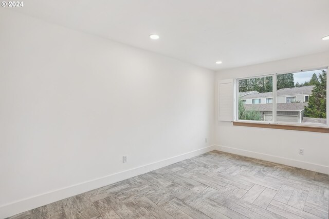 kitchen featuring sink, wood-type flooring, white cabinetry, and stainless steel appliances