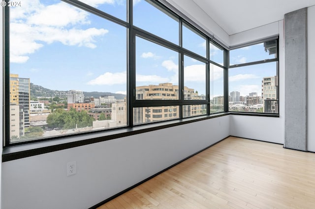 unfurnished sunroom featuring plenty of natural light