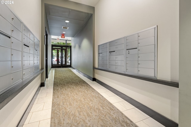 hallway featuring a mail area