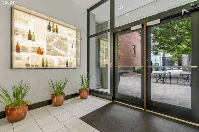 doorway to outside with tile patterned floors