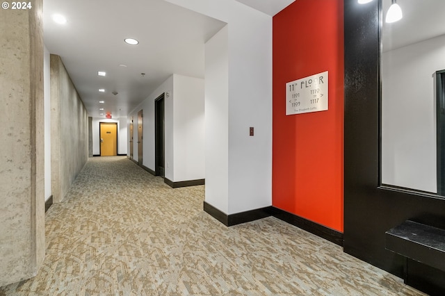 hallway with light colored carpet