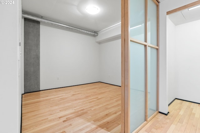 walk in closet featuring light hardwood / wood-style floors