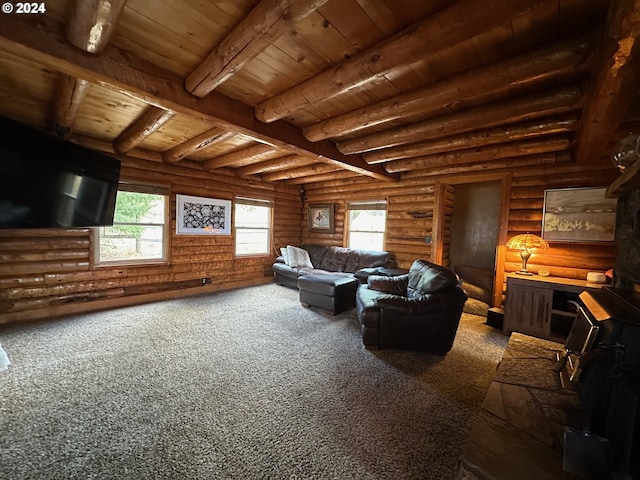 carpeted living room with beamed ceiling and wood ceiling