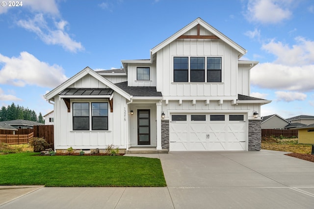 modern farmhouse style home with a garage and a front yard