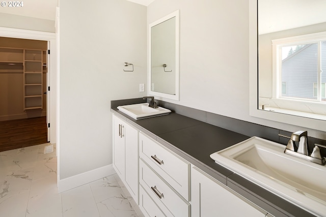 bathroom featuring tile flooring and vanity