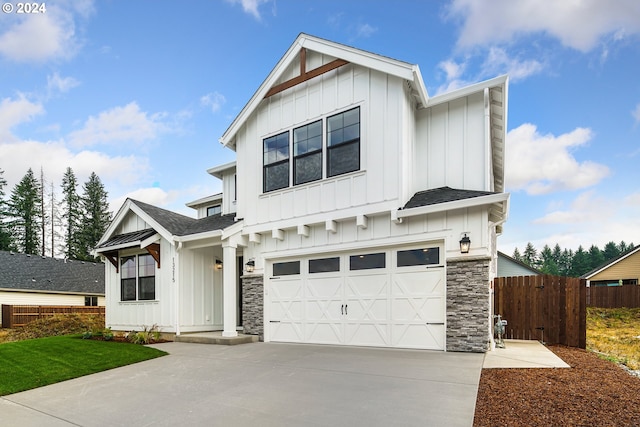 modern inspired farmhouse with a garage