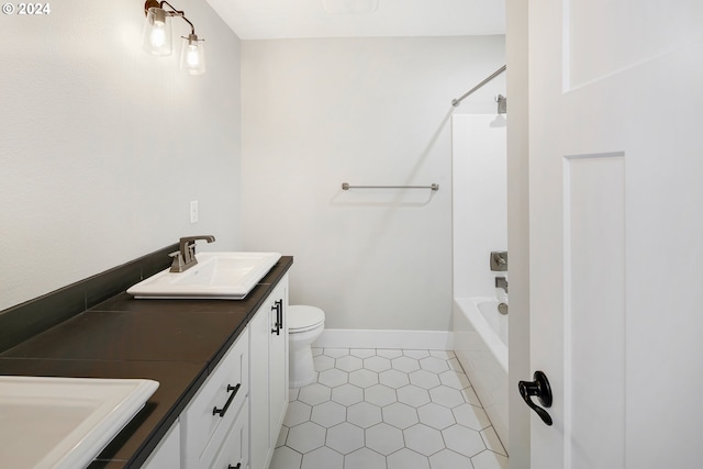 full bathroom with tile flooring, vanity, toilet, and shower / washtub combination