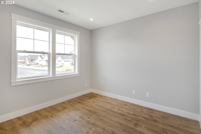 unfurnished room featuring wood-type flooring