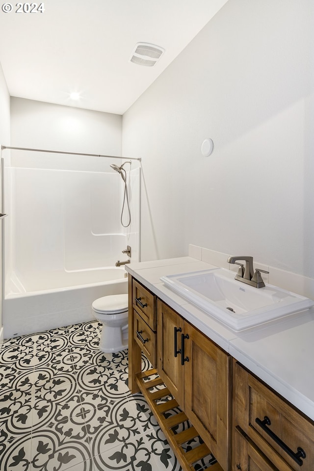 full bathroom with tile flooring, vanity, toilet, and shower / bathing tub combination