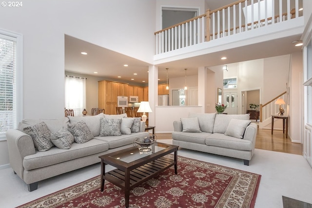 living room with a towering ceiling