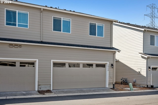 view of side of home with a garage