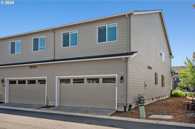 exterior space with a garage