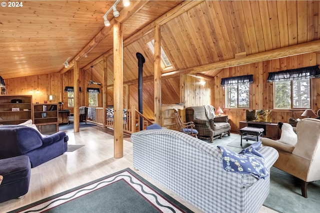 interior space featuring lofted ceiling with beams, wooden walls, hardwood / wood-style flooring, and wood ceiling