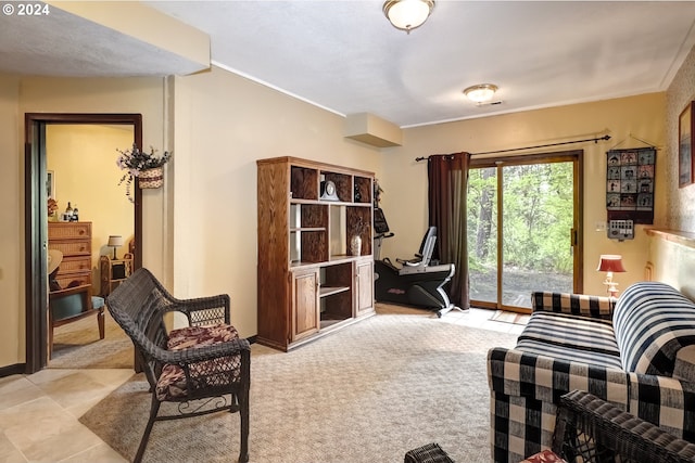 interior space featuring crown molding and light carpet