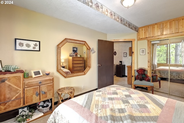 bedroom with a closet and a textured ceiling