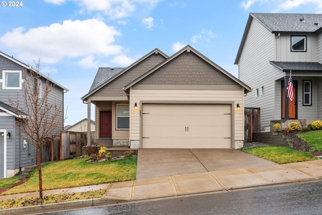 view of front of property with a front lawn and a garage