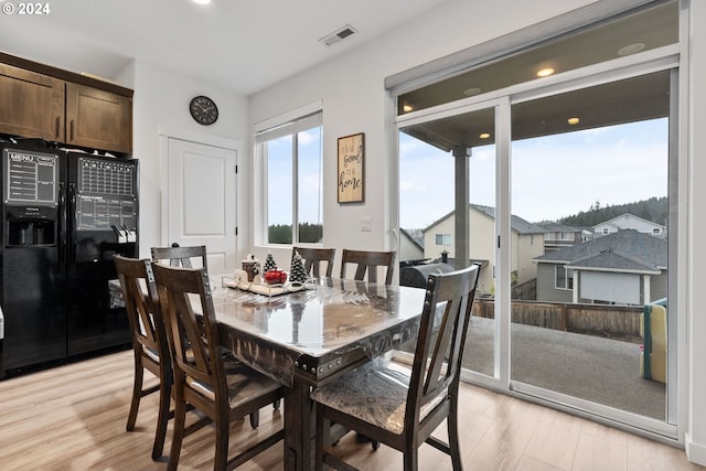 dining room with light hardwood / wood-style flooring