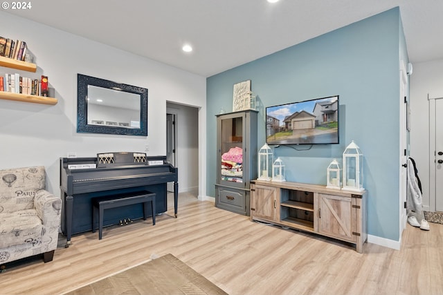 living area with light hardwood / wood-style flooring