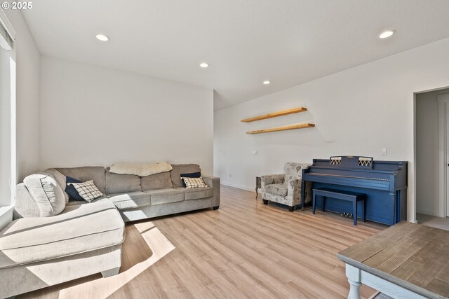 living area featuring wood finished floors, recessed lighting, and baseboards