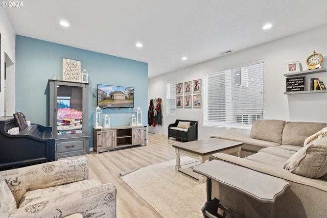 living room with light hardwood / wood-style flooring