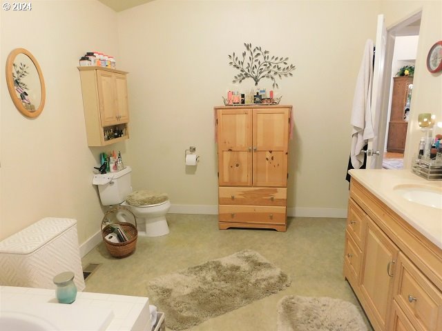 bathroom with vanity and toilet