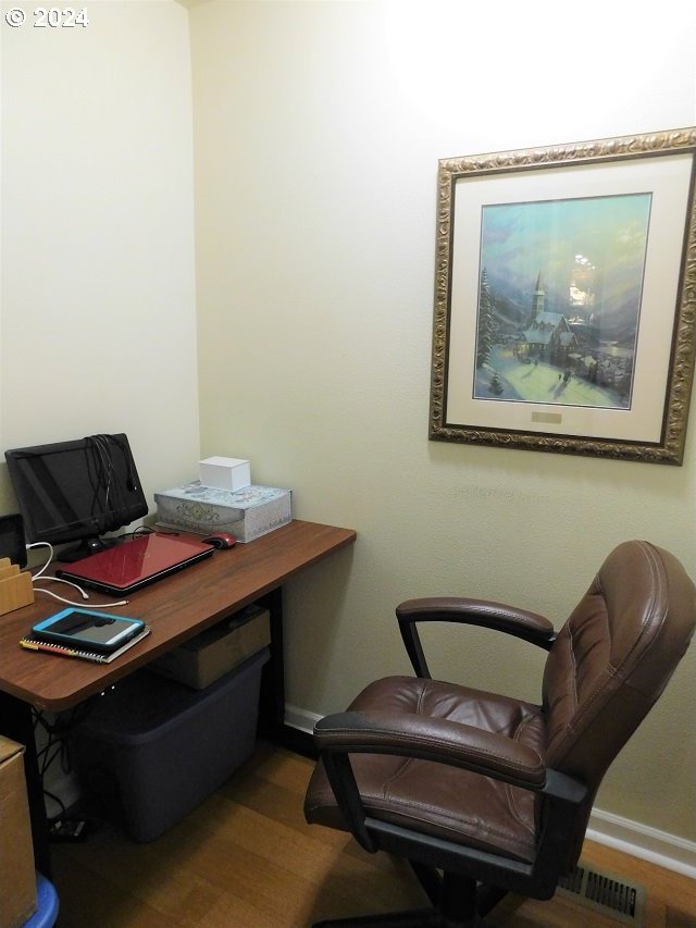 office space with hardwood / wood-style flooring