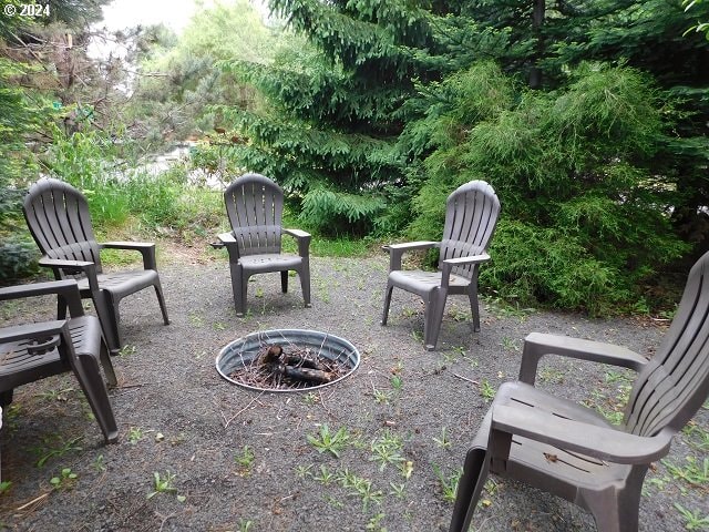 exterior space featuring an outdoor fire pit