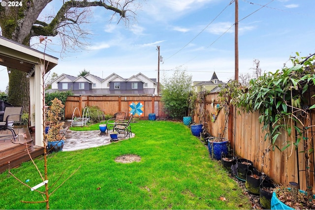 view of yard featuring a patio area and a fenced backyard