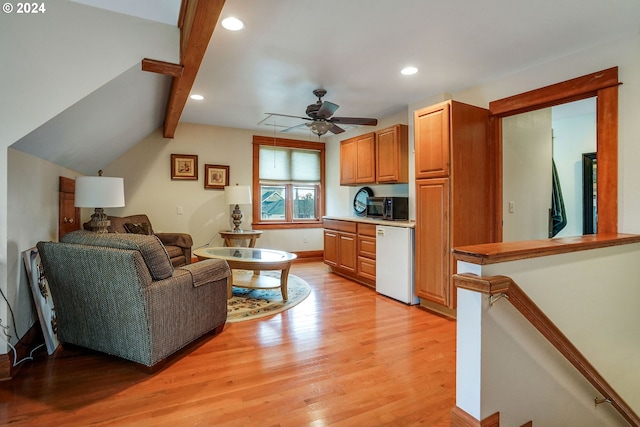 living room featuring light wood-type flooring, vaulted ceiling with beams, a ceiling fan, and recessed lighting