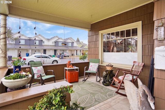 view of patio / terrace with covered porch and a residential view