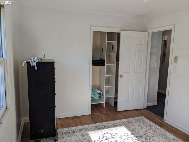 bedroom featuring dark hardwood / wood-style floors