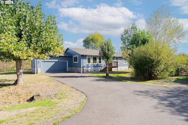 ranch-style home featuring a garage