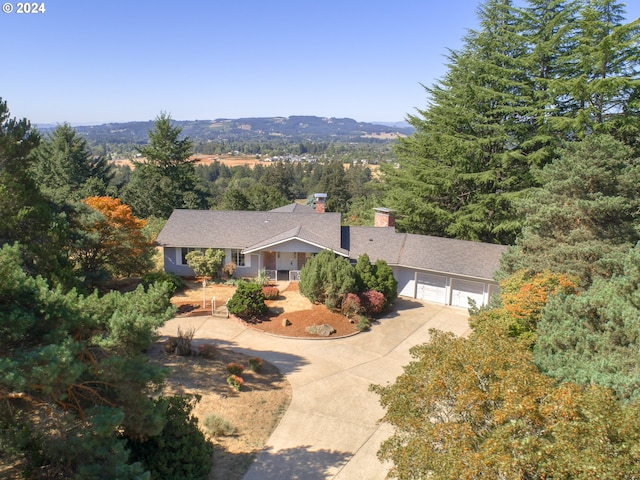 drone / aerial view with a wooded view