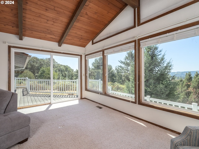 unfurnished sunroom with vaulted ceiling with beams, wooden ceiling, and visible vents