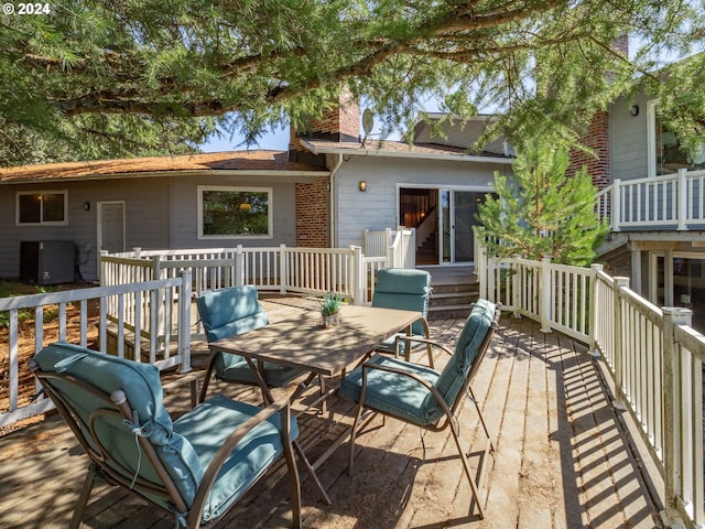 deck with outdoor dining area