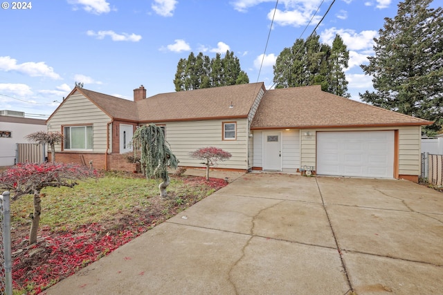 single story home featuring a garage