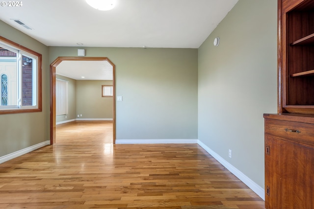 hallway with light wood-type flooring