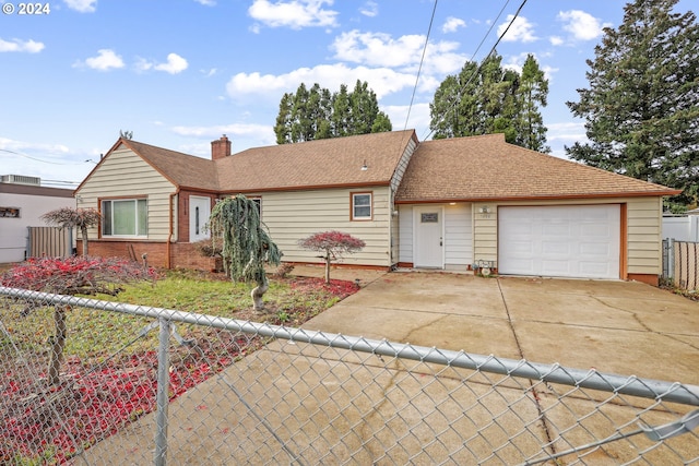 single story home featuring a garage