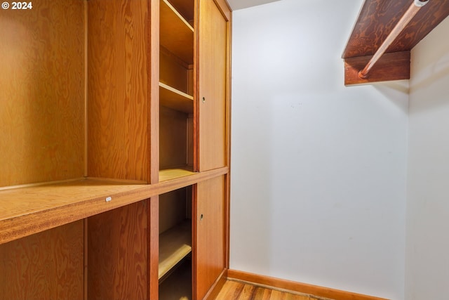 walk in closet featuring light hardwood / wood-style floors