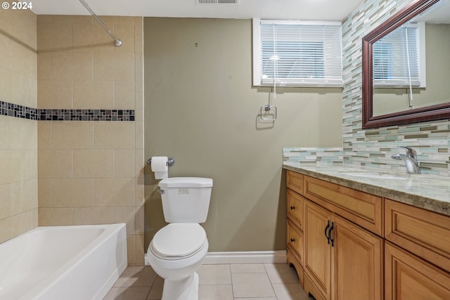 full bathroom with tile patterned flooring, decorative backsplash, toilet, and tiled shower / bath