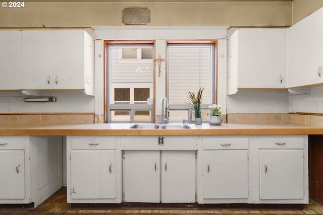 kitchen with sink and white cabinetry