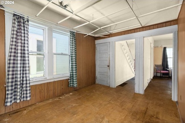 interior space featuring wood walls