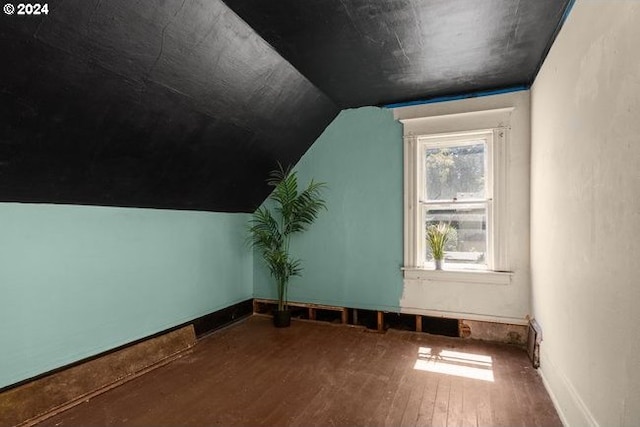 bonus room with vaulted ceiling and hardwood / wood-style floors