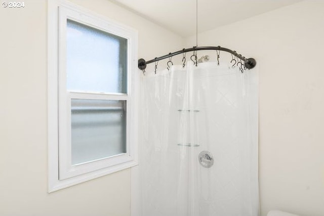 bathroom with curtained shower