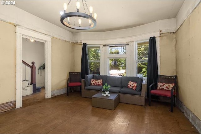 living room featuring hardwood / wood-style floors and a chandelier